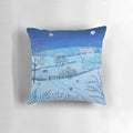 Serene snow-covered landscape at night with a full moon and wandering fox, featured on a decorative pillow