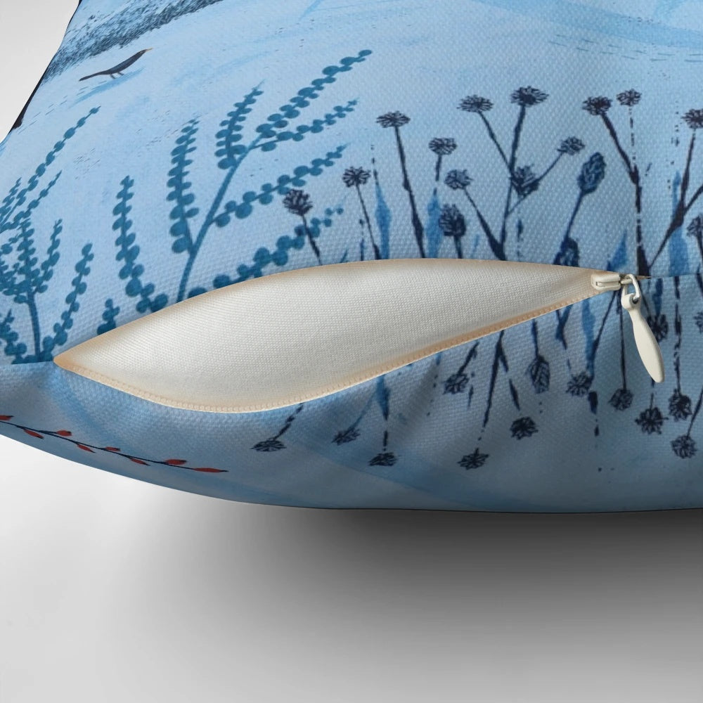 Serene snow-covered landscape at night with a full moon and wandering fox, featured on a decorative pillow
