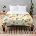 Pastel plush blanket with a captivating luna moth design