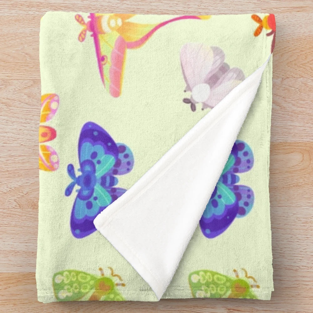 Pastel plush blanket with a captivating luna moth design