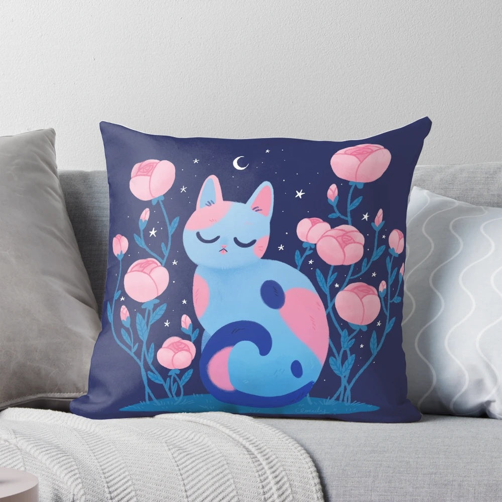 A soft, plush pillow featuring a vibrant peony flower design and a playful cat motif.