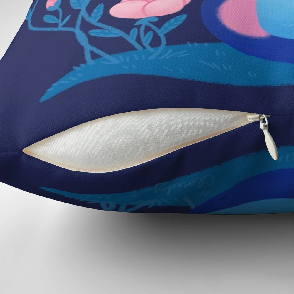 A soft, plush pillow featuring a vibrant peony flower design and a playful cat motif.
