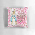 Delicate pink floral pillow featuring the beloved Peter Rabbit character from Beatrix Potter's classic children's books.