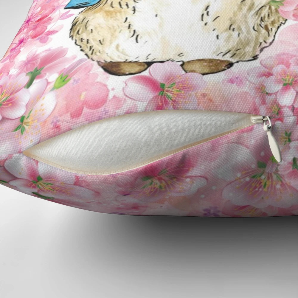 Delicate pink floral pillow featuring the beloved Peter Rabbit character from Beatrix Potter's classic children's books.