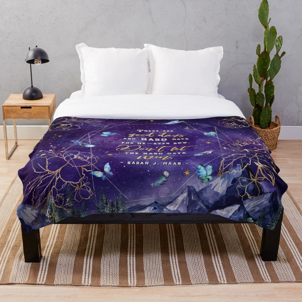 Plush blanket with a fantasy-inspired night sky and stars design