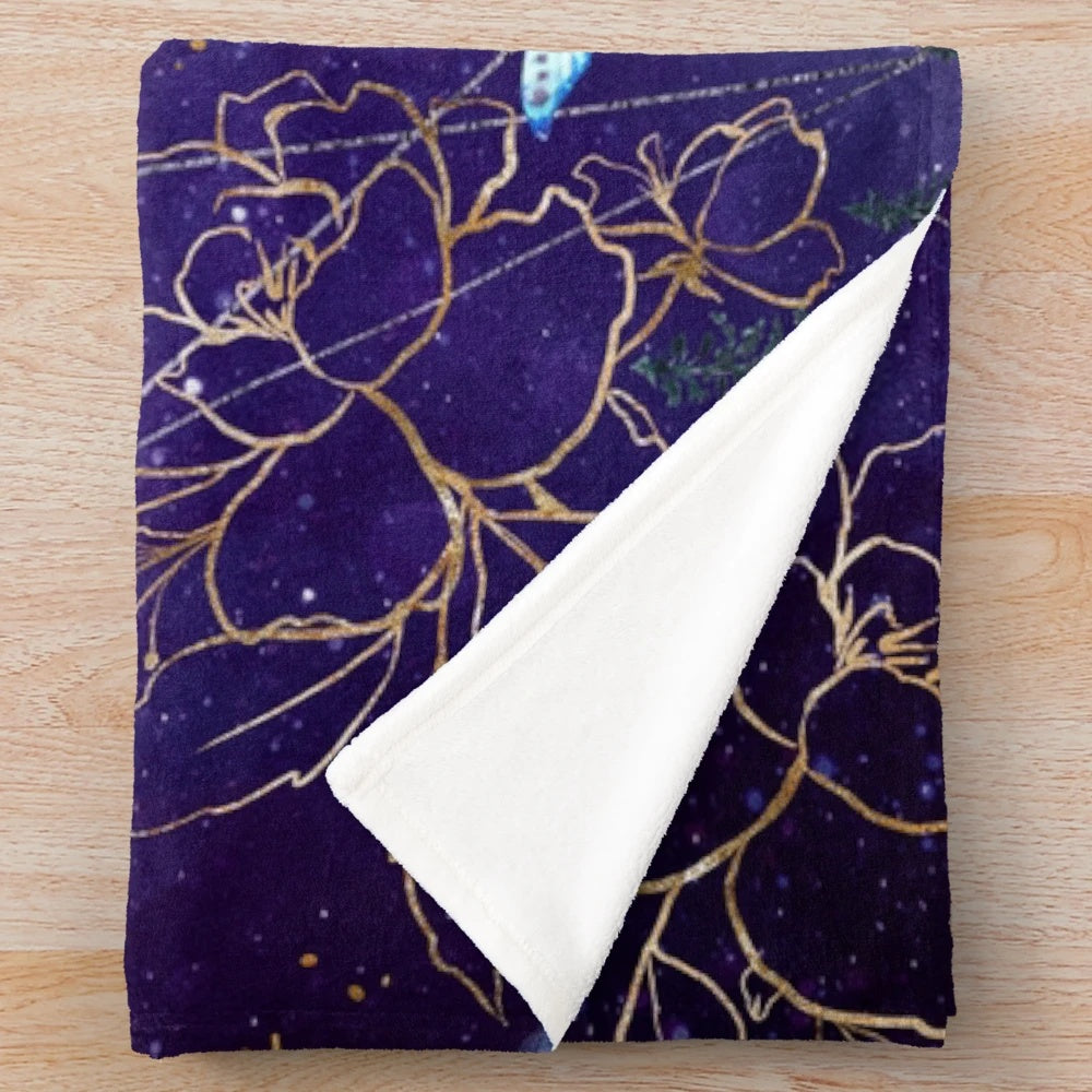 Plush blanket with a fantasy-inspired night sky and stars design