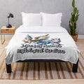 Plush blanket with illustrations of fantastical creatures like unicorns, dragons, and griffins