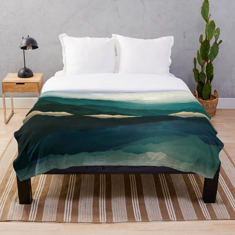 Plush blanket with a nature landscape reflection design