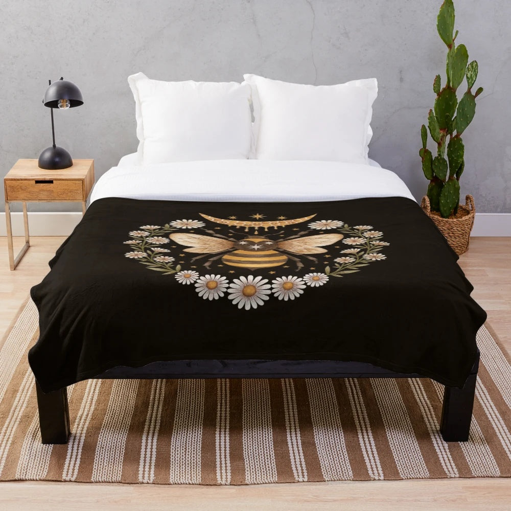 Cozy plush blanket featuring a magical moon and honeycomb design