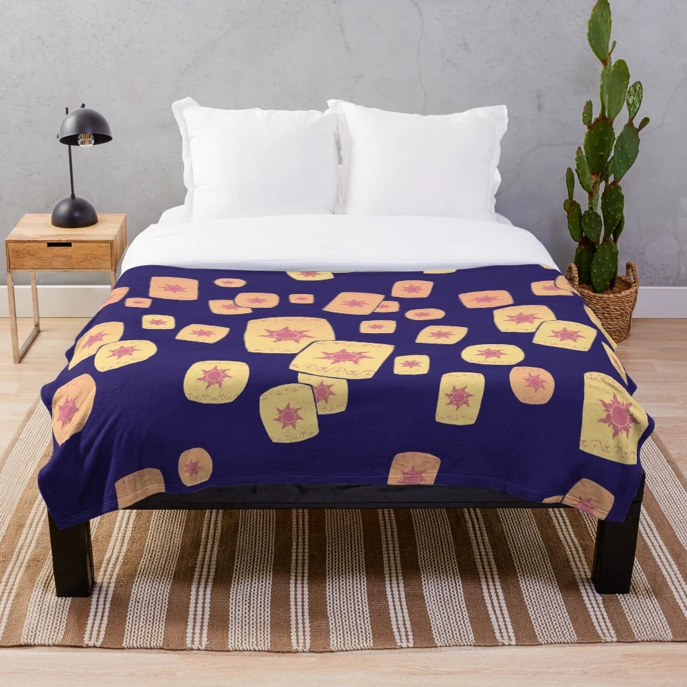 Plush blanket with a design featuring floating lanterns, a nod to the Disney film Tangled