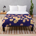 Plush blanket with a design featuring floating lanterns, a nod to the Disney film Tangled