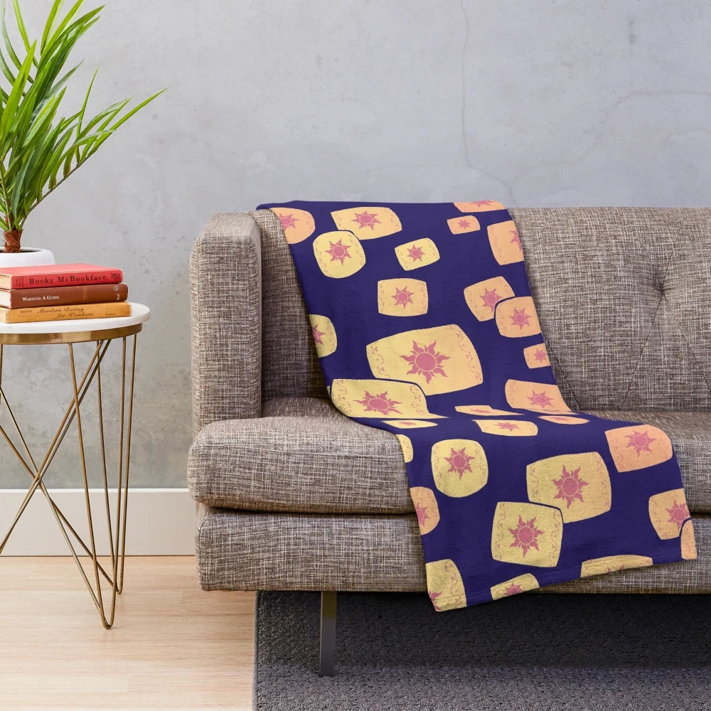 Plush blanket with a design featuring floating lanterns, a nod to the Disney film Tangled