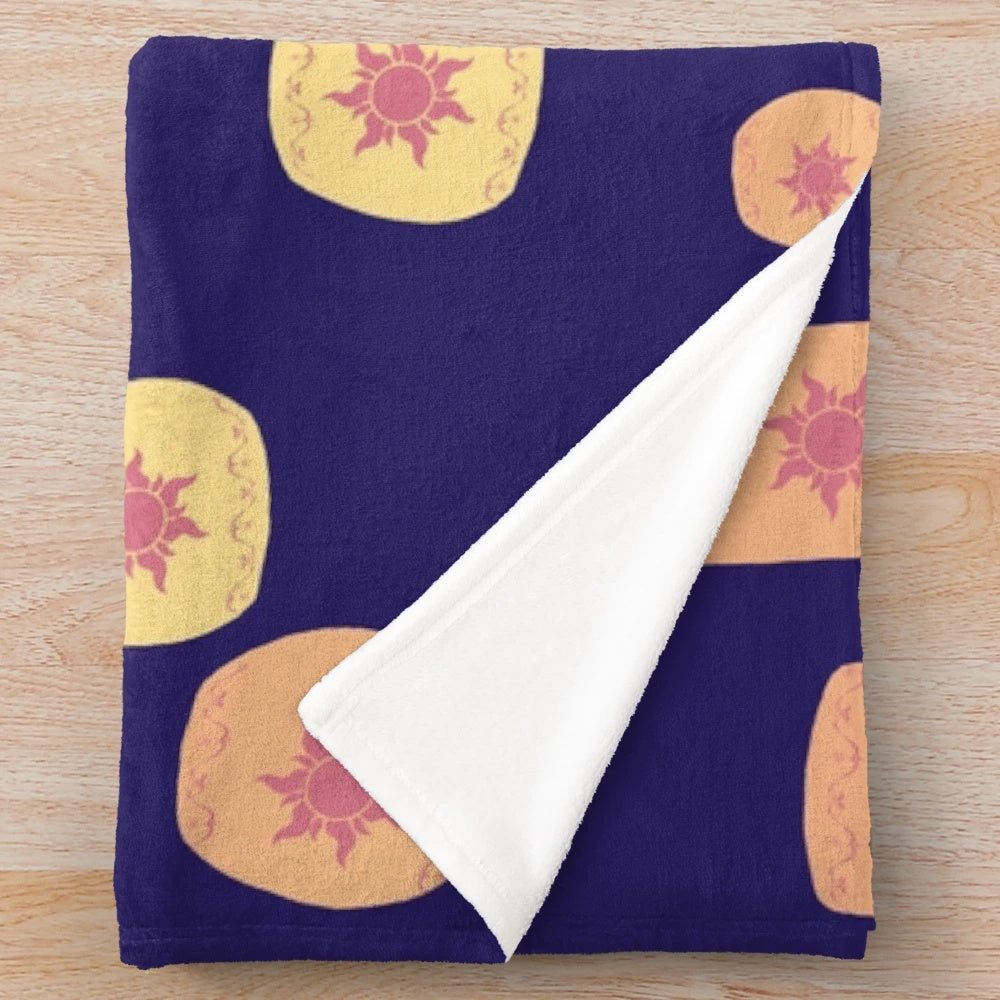 Plush blanket with a design featuring floating lanterns, a nod to the Disney film Tangled