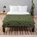Plush blanket with folk horror-inspired design