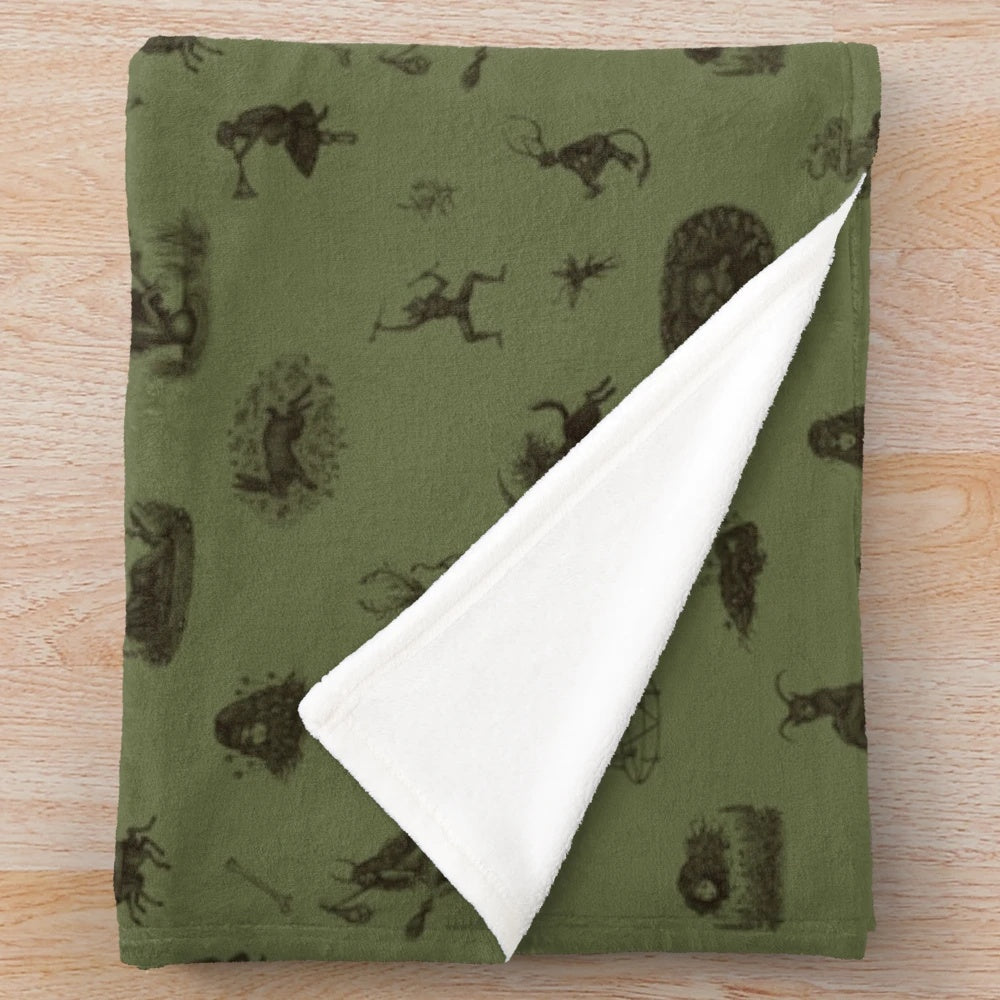Plush blanket with folk horror-inspired design