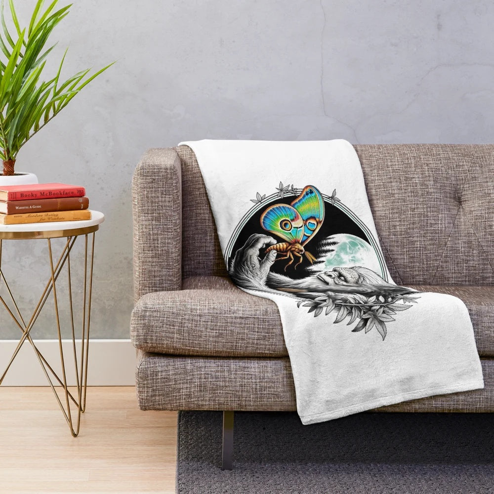 Plush blanket featuring mythological creatures like Bigfoot and Moon Moth