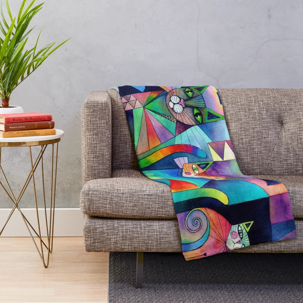 Plush blanket with abstract, colorful cats in a moonlit fantasy scene