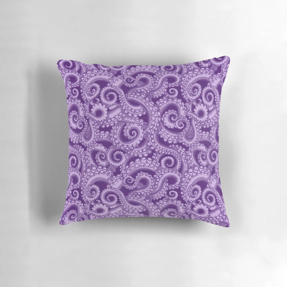 A vibrant purple octopus tentacle pillow with a whimsical sea witch design
