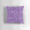 A vibrant purple octopus tentacle pillow with a whimsical sea witch design