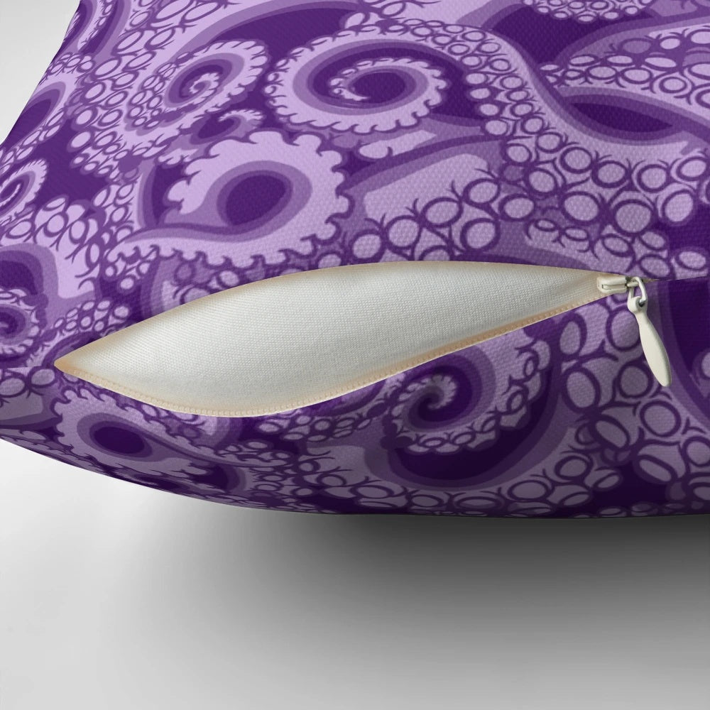 A vibrant purple octopus tentacle pillow with a whimsical sea witch design