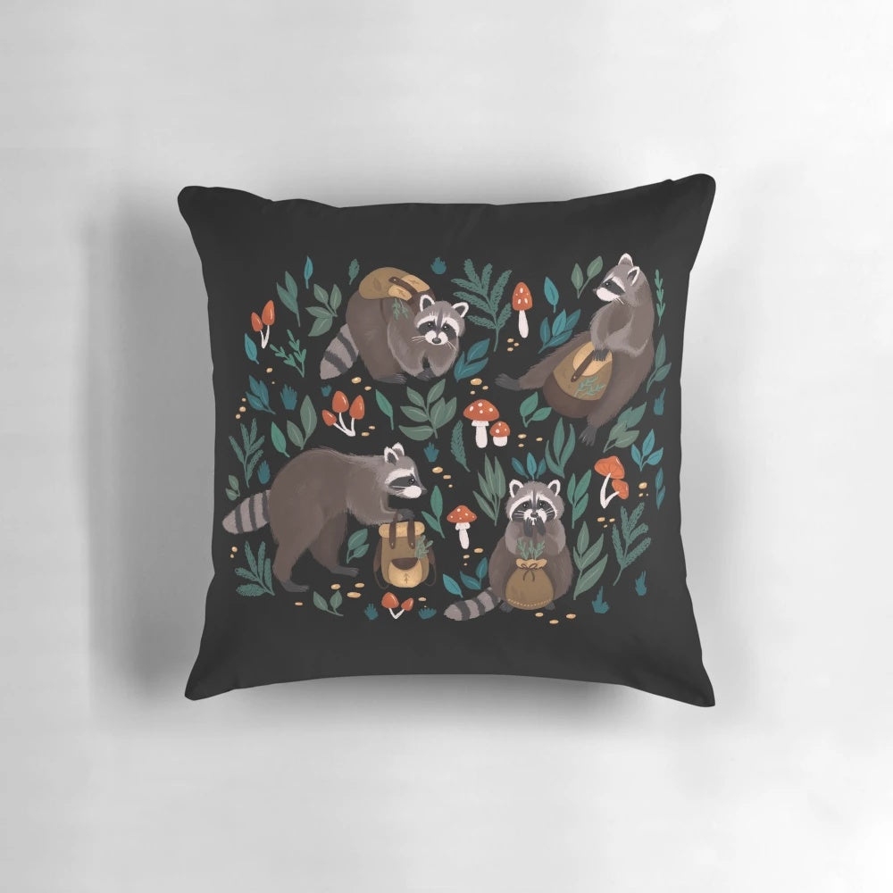 A whimsical Raccoon pillow with a floral and autumn-inspired design.