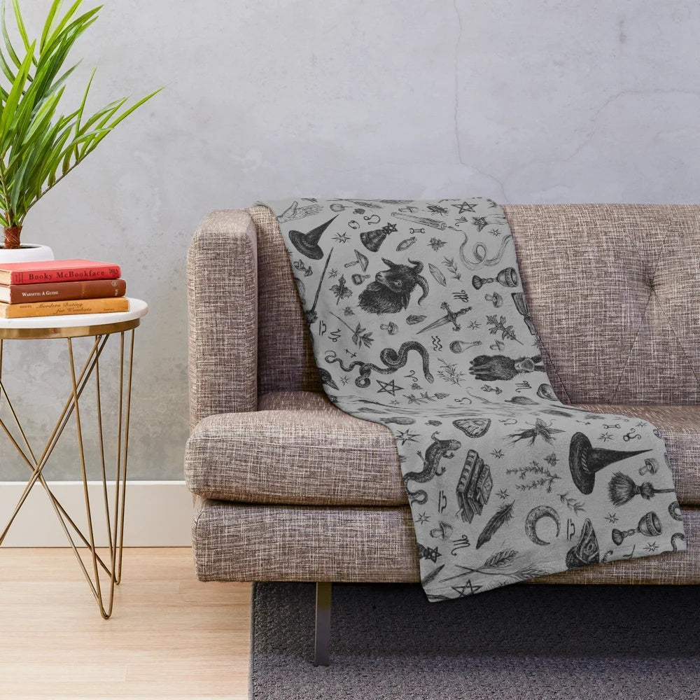 Salem witch plush blanket with rabbit, snake, and crow motifs
