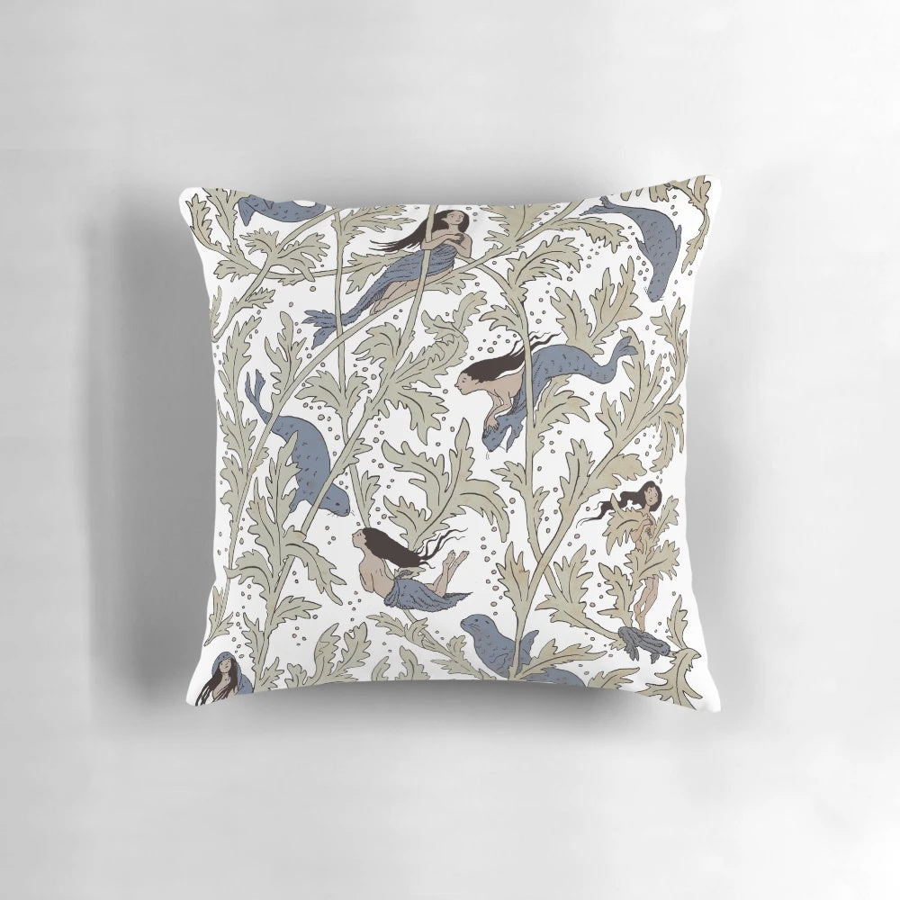 A decorative pillow featuring a swirling, ethereal design inspired by the mythical selkie creatures of coastal folklore.