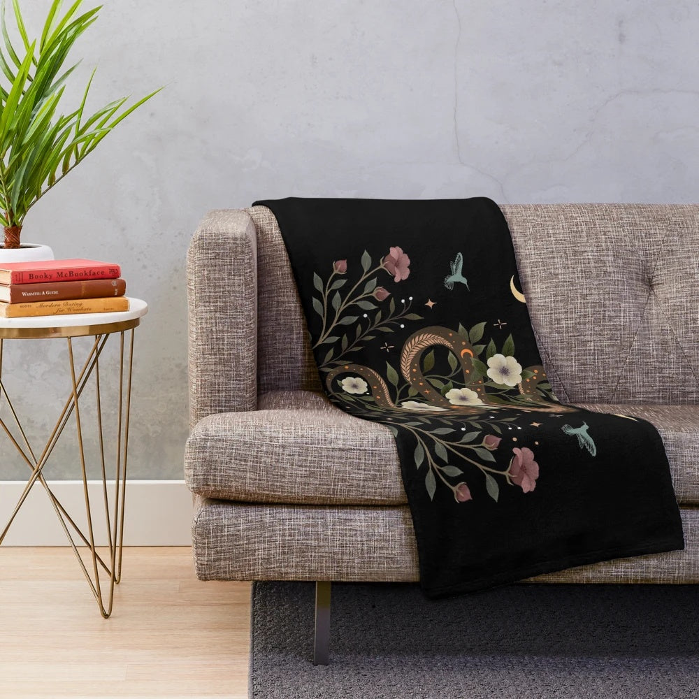 Serpent-themed plush blanket with botanical and mystical elements