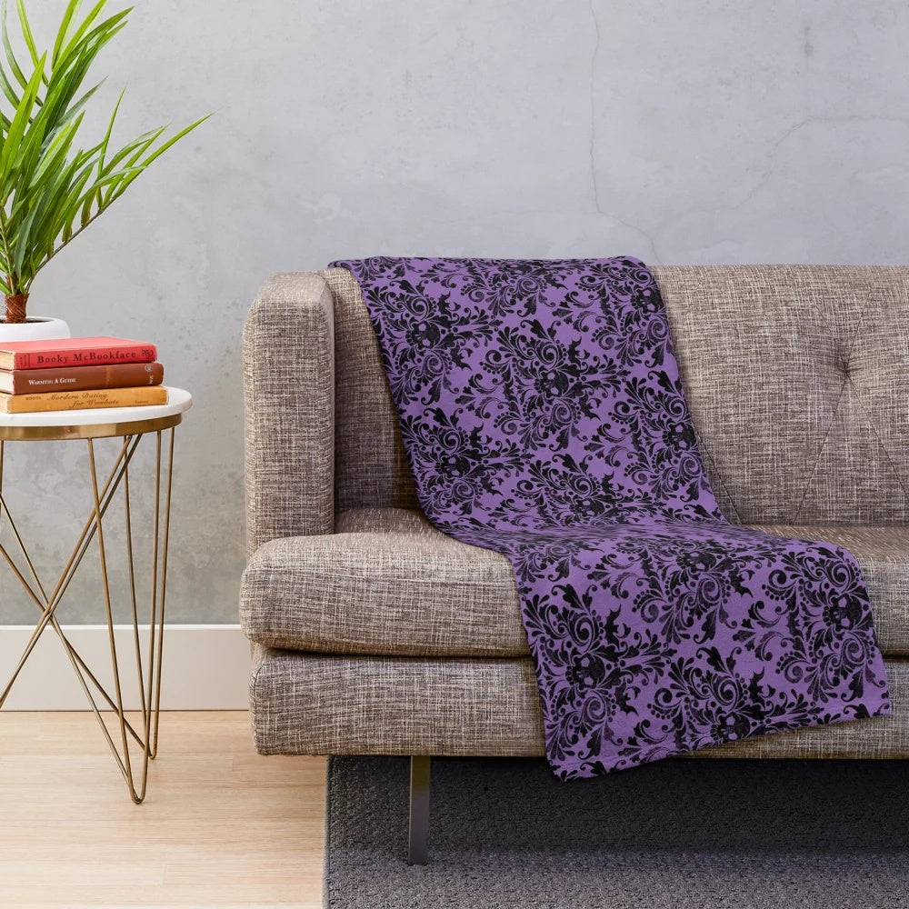 Plush blanket featuring a gothic skull damask pattern