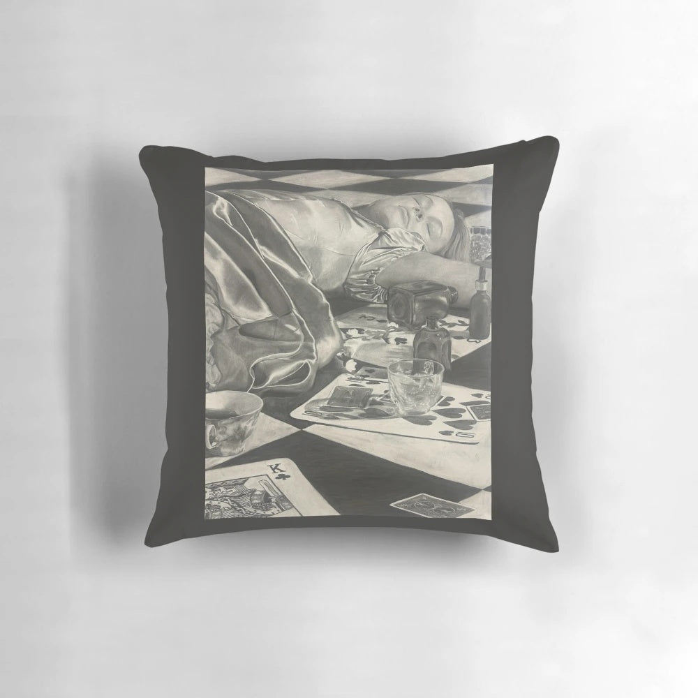 A black and white charcoal portrait of a sleeping Alice from Alice in Wonderland, printed on a pillow.