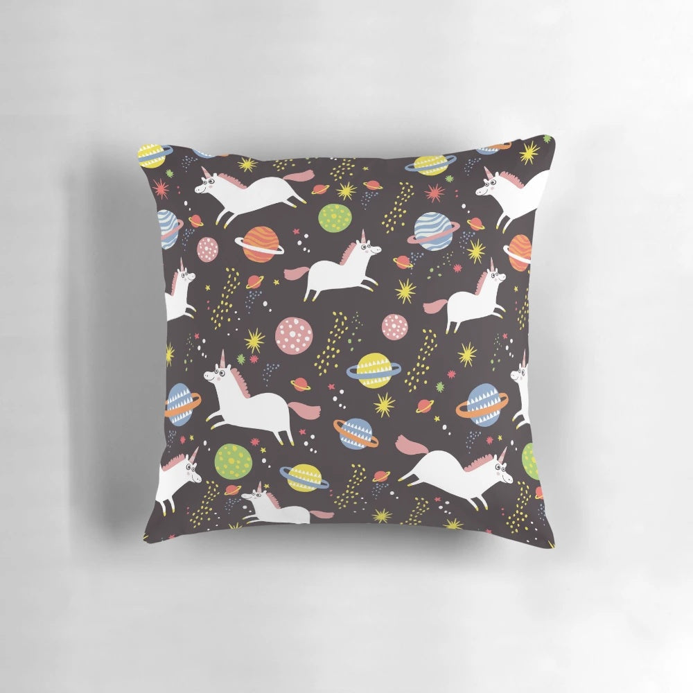 A cozy throw pillow featuring a delightful space unicorn design in a retro, cosmic pattern.