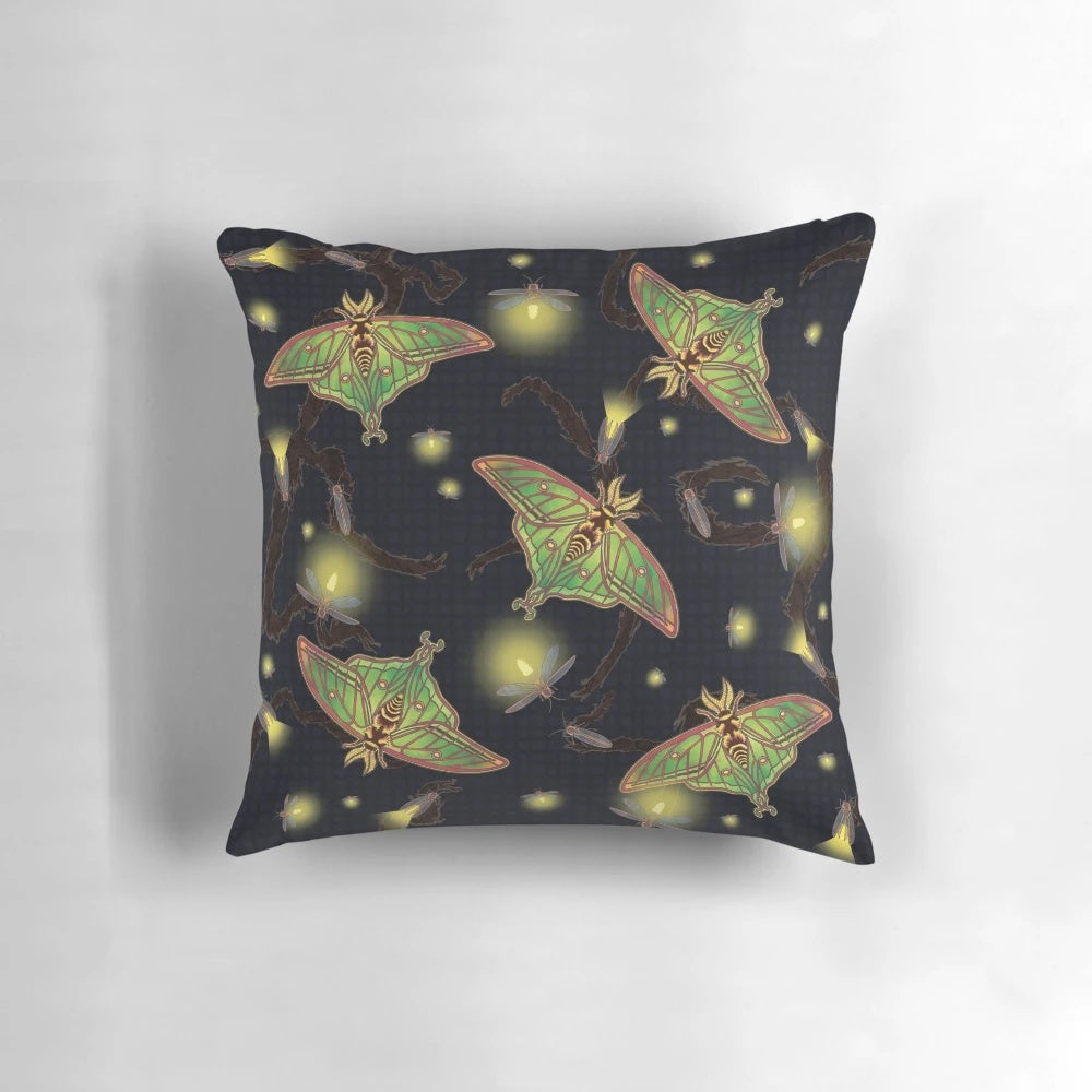 Image of a Spanish luna moth and fireflies on a stained glass-inspired pillow design