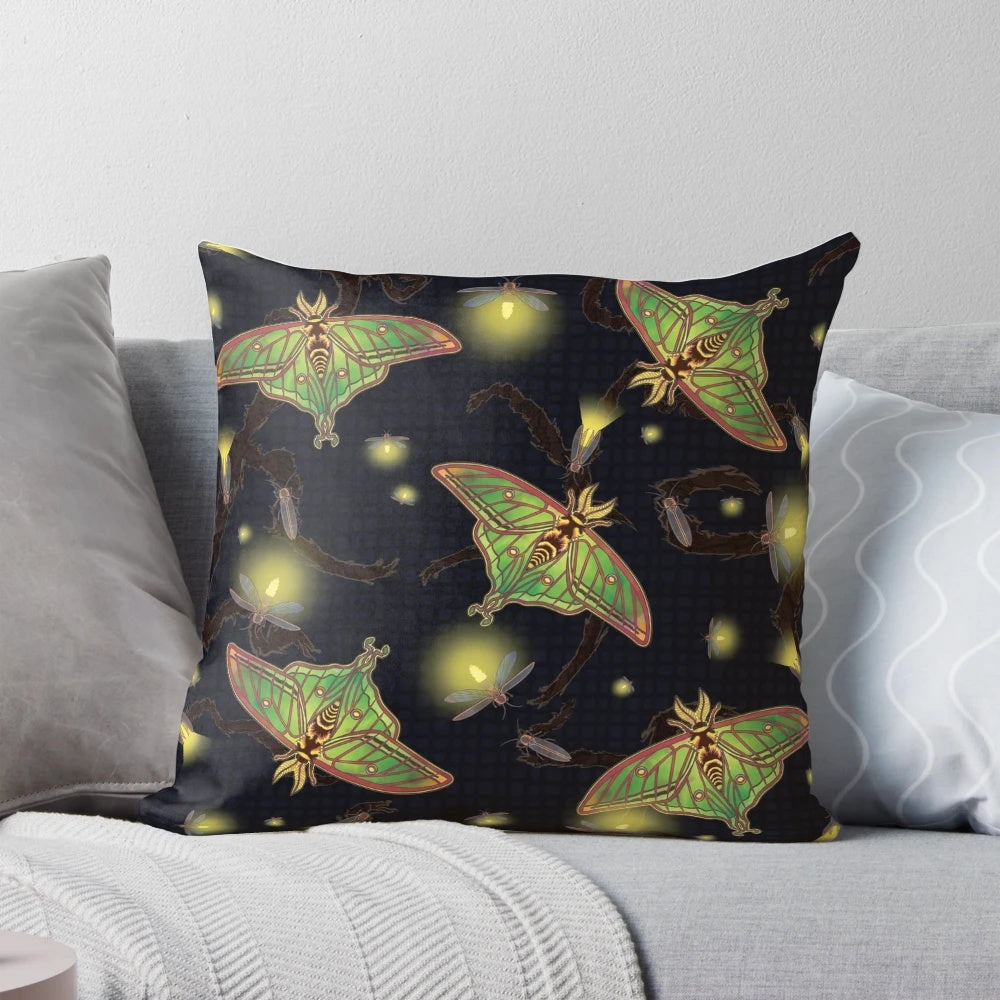 Image of a Spanish luna moth and fireflies on a stained glass-inspired pillow design