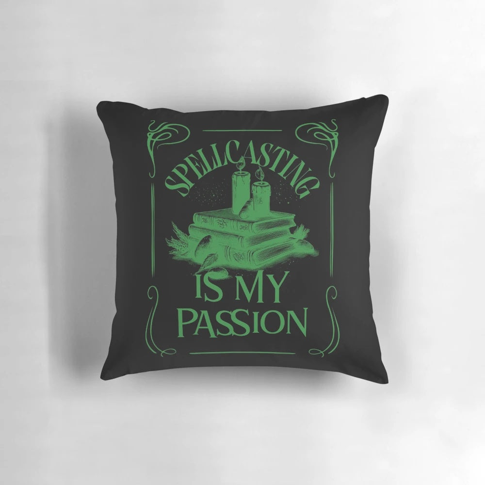 A plush, decorative pillow featuring the design "Spellcasting is my passion" with magical elements like a cauldron, crystals, and spooky text.