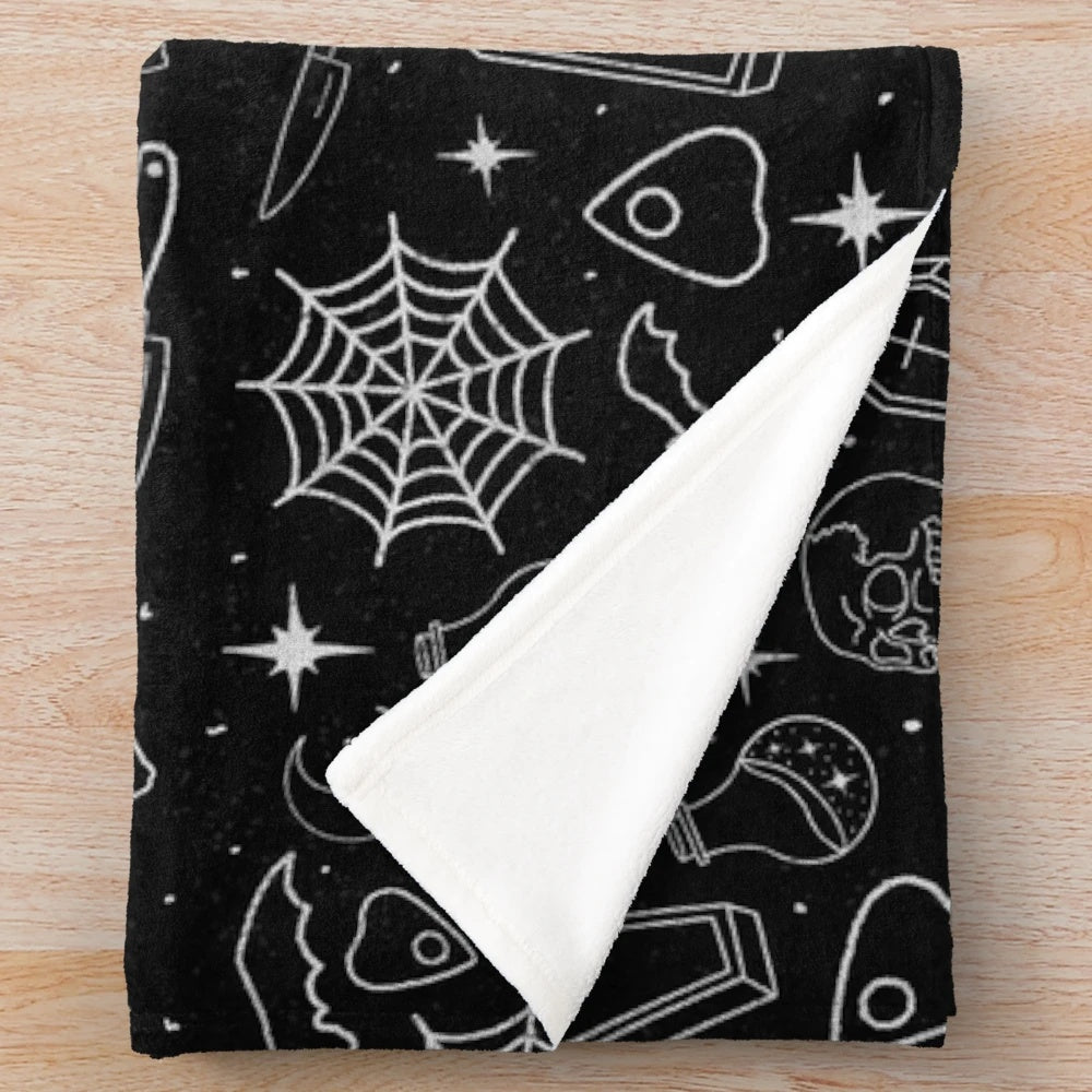 Spooky season plush blanket with gothic, ominous design