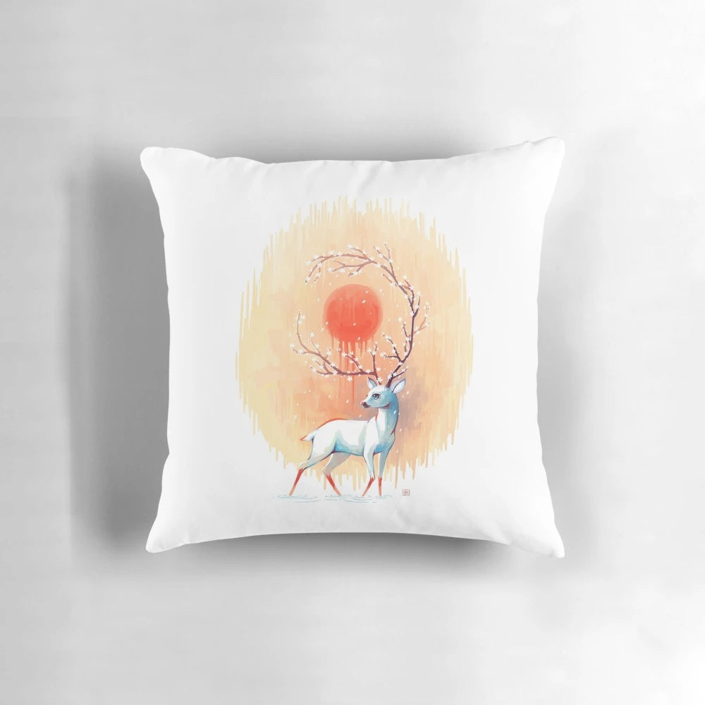 Whimsical spring pillow featuring a deer in a floral fantasy landscape