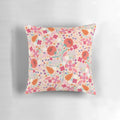 A beautiful spring-themed pillow featuring a floral and leaf design in shades of pink and green