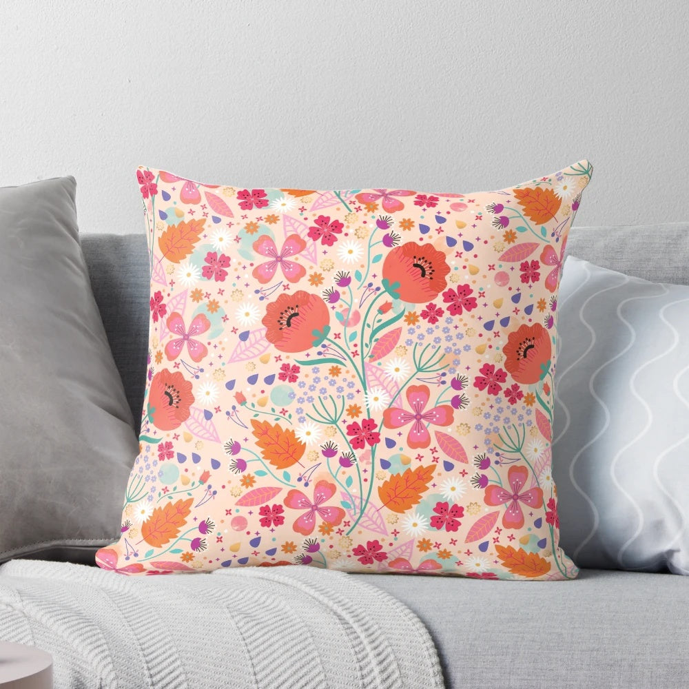 A beautiful spring-themed pillow featuring a floral and leaf design in shades of pink and green
