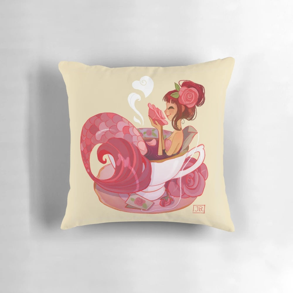 A whimsical tea mermaid pillow, featuring a vintage-inspired mermaid figure surrounded by delicate teacups and saucers.