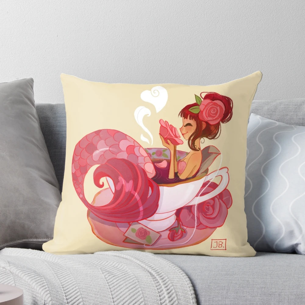 A whimsical tea mermaid pillow, featuring a vintage-inspired mermaid figure surrounded by delicate teacups and saucers.