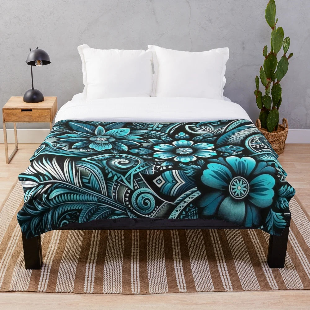 Teal and turquoise plush blanket with tropical floral and Polynesian design