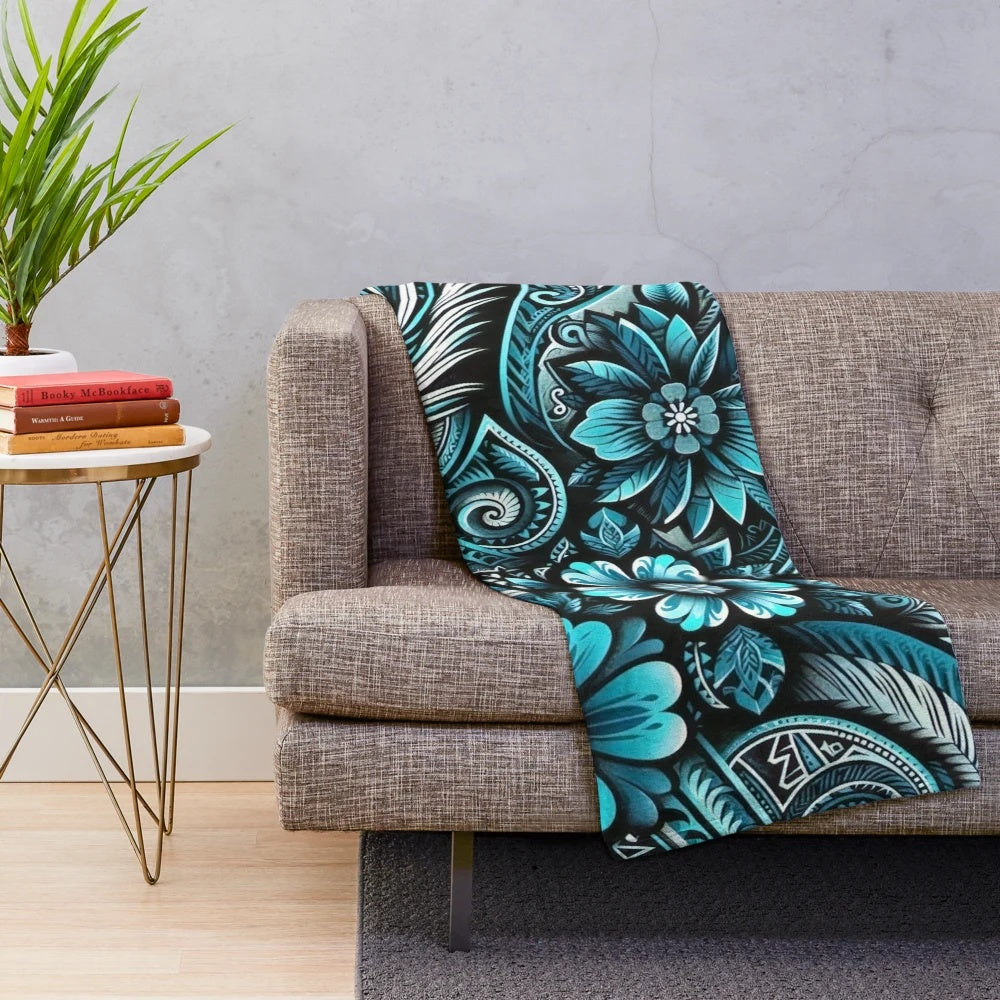 Teal and turquoise plush blanket with tropical floral and Polynesian design