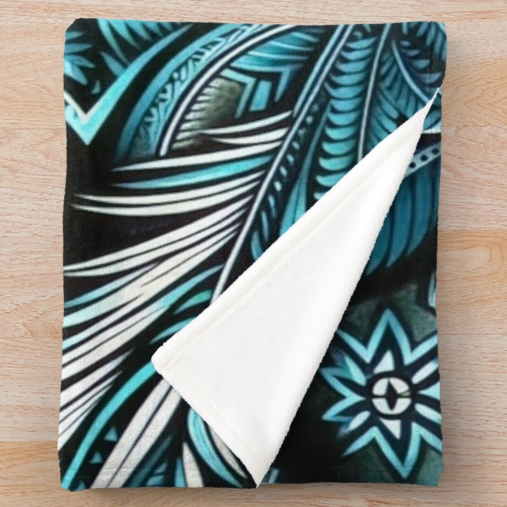 Teal and turquoise plush blanket with tropical floral and Polynesian design
