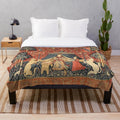 The Lady and the Unicorn plush blanket featuring a mythological unicorn and floral design