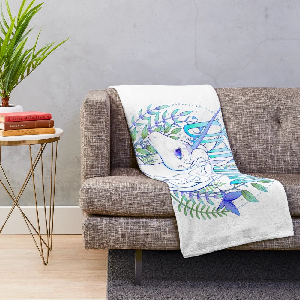 The Last Unicorn-inspired plush blanket featuring a whimsical unicorn design