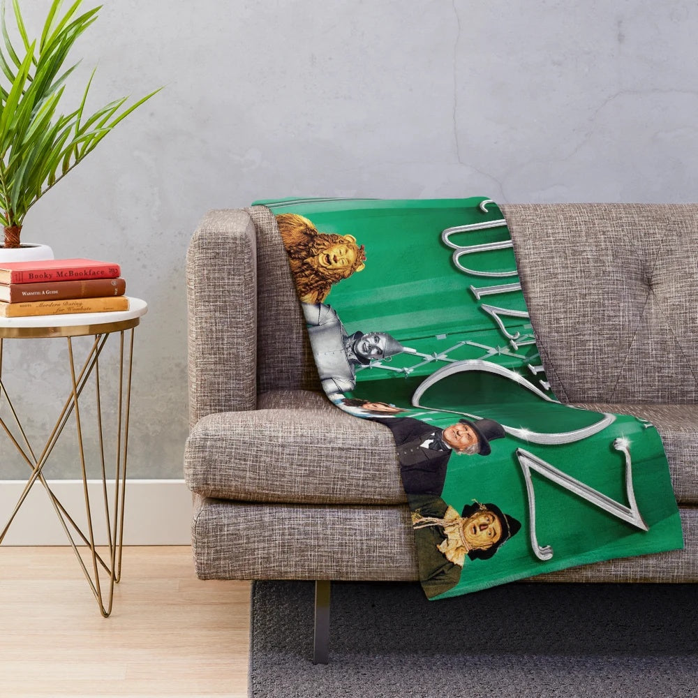 The Wizard Of Oz inspired plush blanket featuring iconic characters and scenes