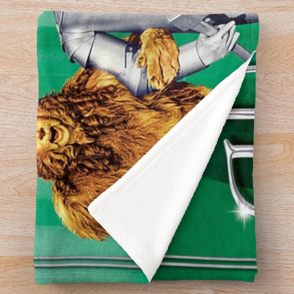 The Wizard Of Oz inspired plush blanket featuring iconic characters and scenes
