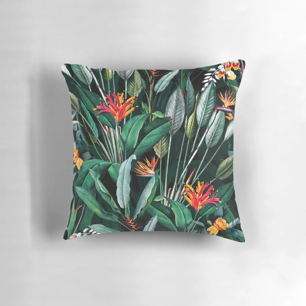 Vintage botanical print pillow with lush tropical leaves and floral motifs.