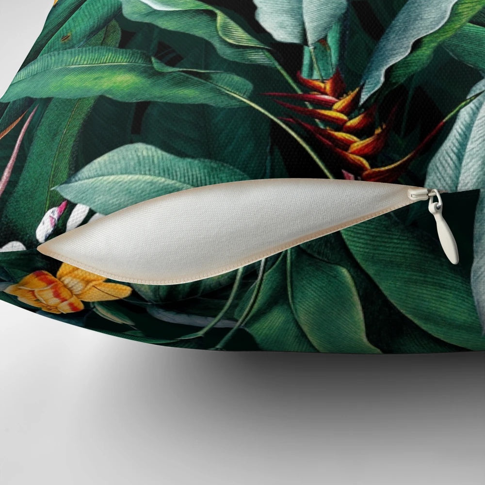 Vintage botanical print pillow with lush tropical leaves and floral motifs.