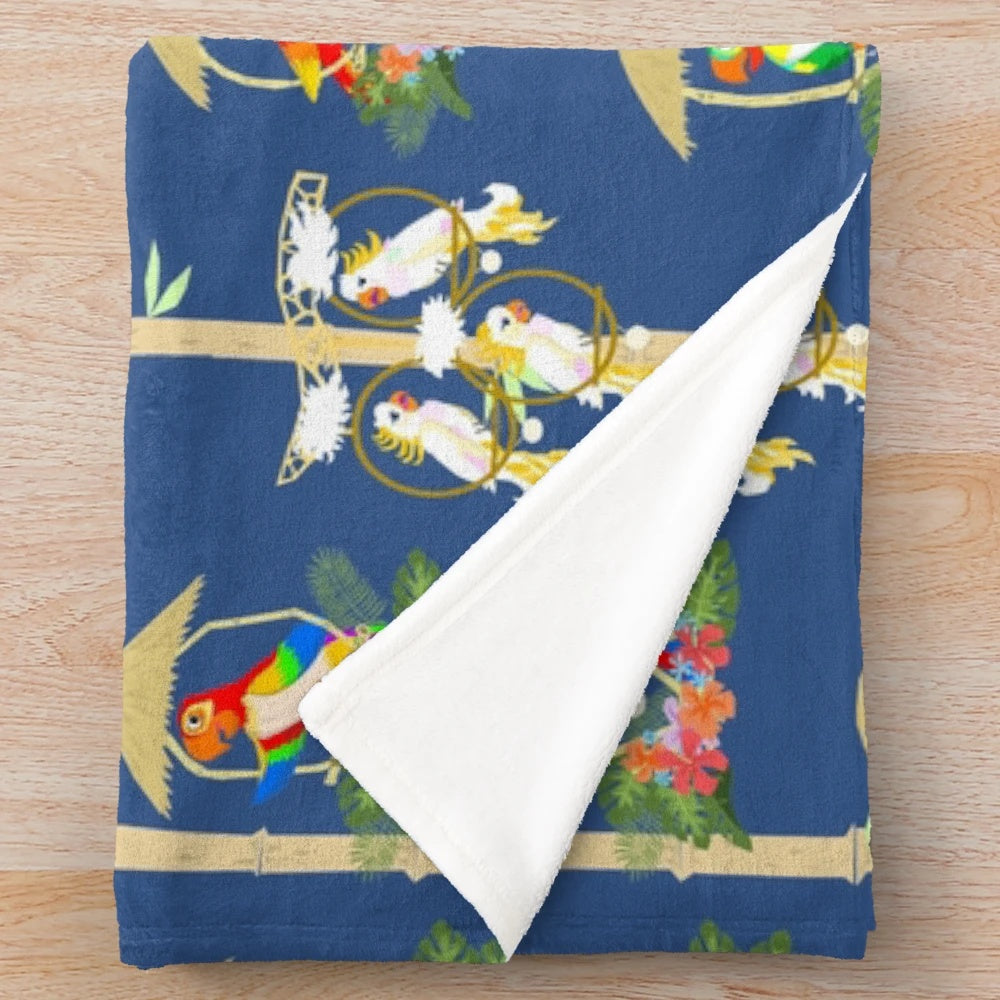 Colorful plush blanket featuring tiki room birds in a tropical paradise